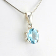 Side View Sterling Silver Blue Topaz 8x10mm Oval Prong Set Pendant