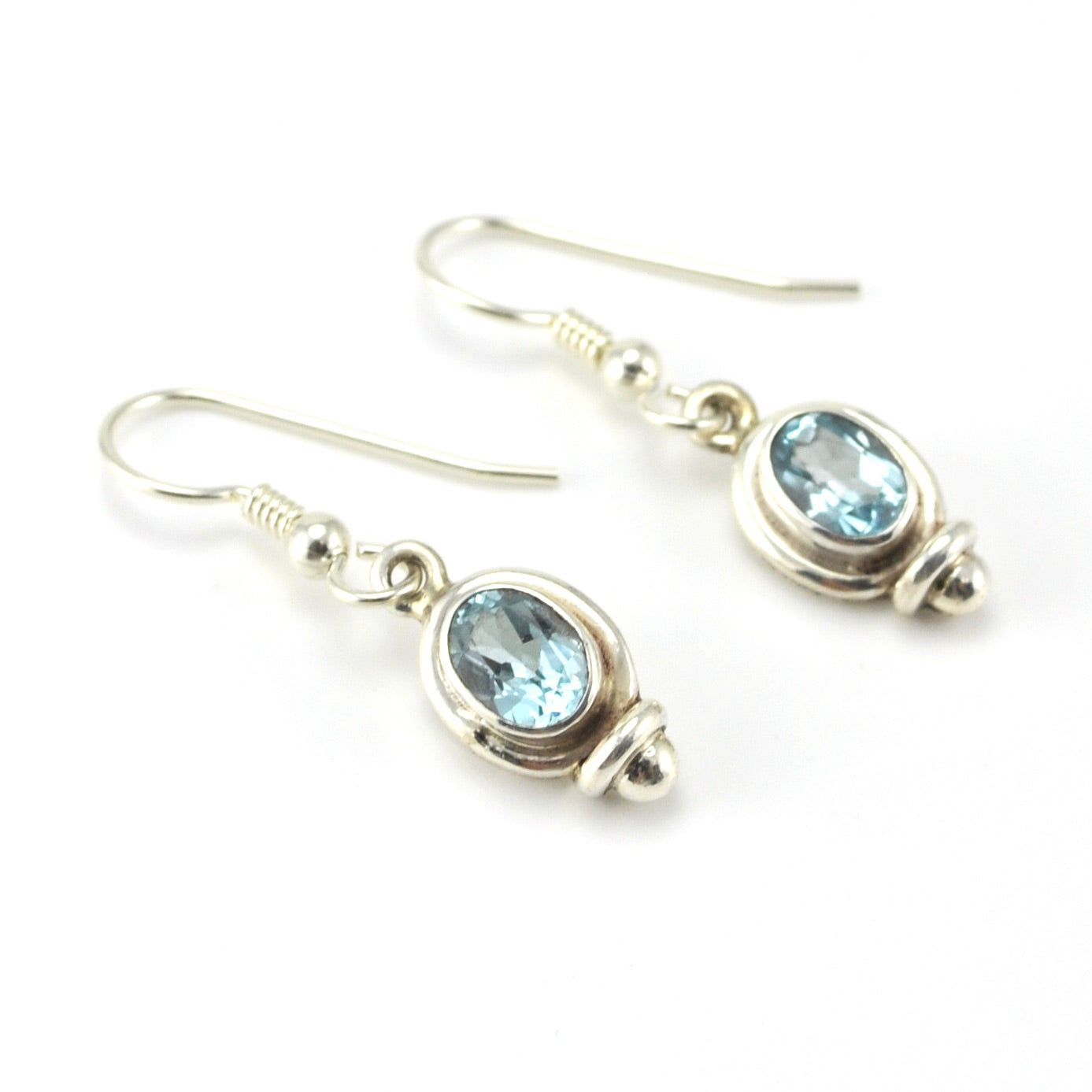 Sterling Silver Blue Topaz 5x7mm Oval Dangle Earrings