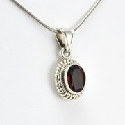 Side View Sterling Silver Garnet 7x9mm Oval Pendant