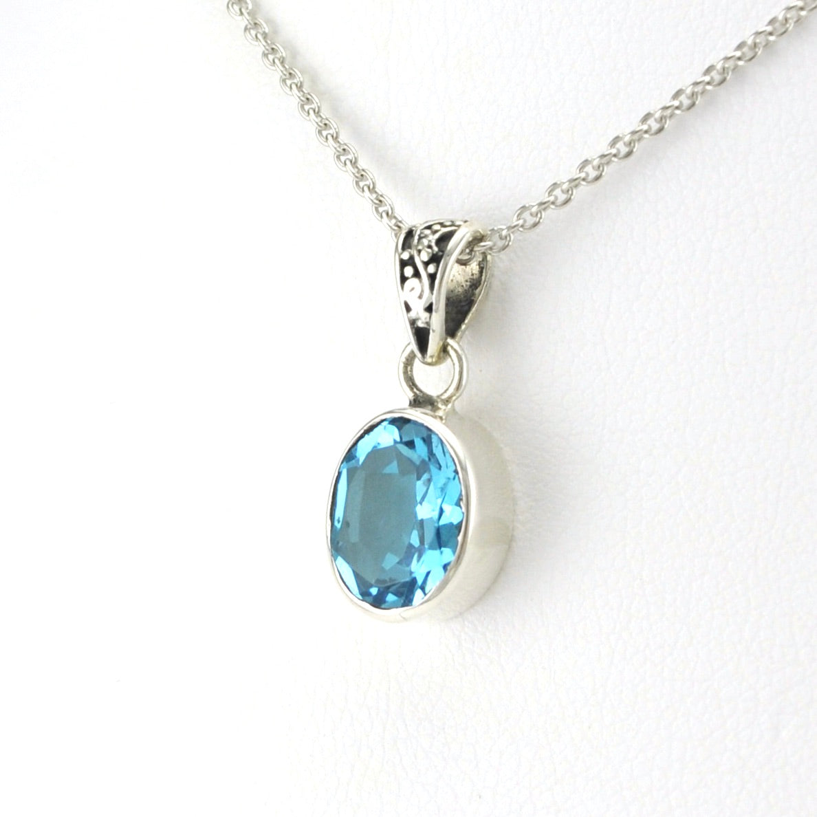 Side View Sterling Silver Blue Topaz 8x10mm Oval Bali Bail Necklace