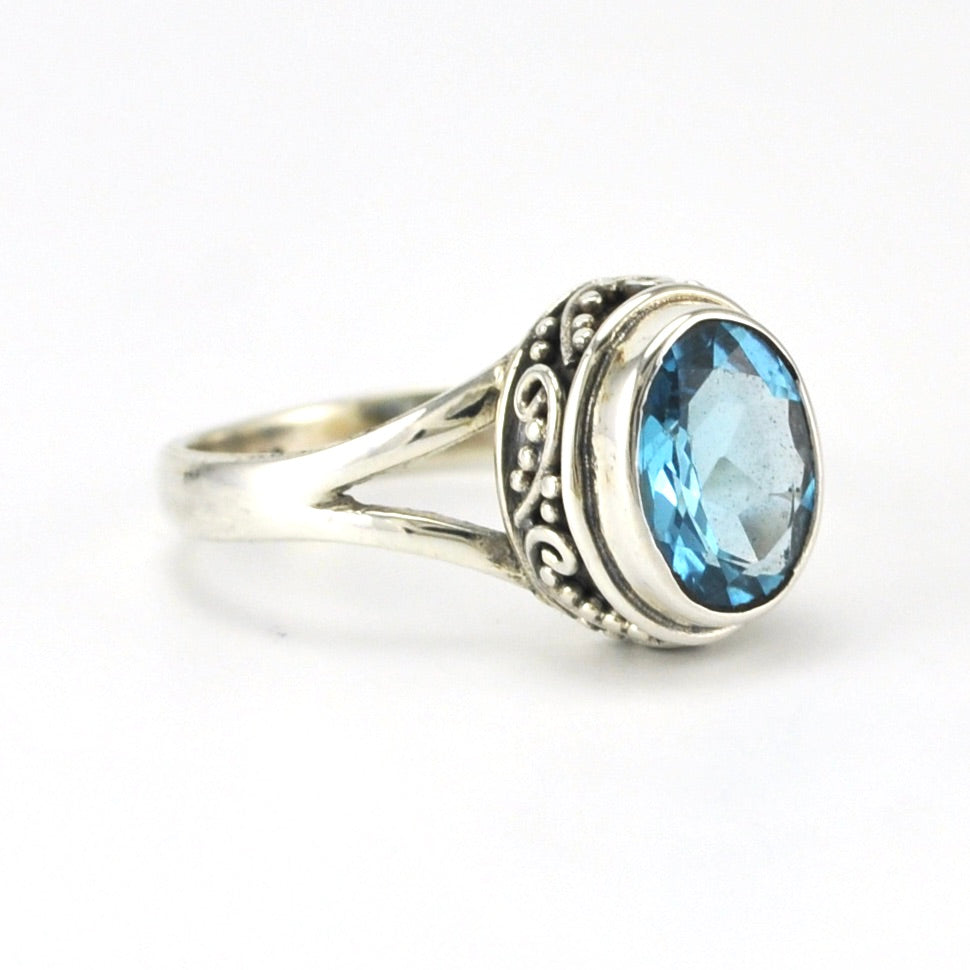 Side View Sterling Silver Blue Topaz 7x9mm Oval Bali Ring