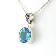 Side View Sterling Silver Blue Topaz 10x12mm Oval Bali Necklace