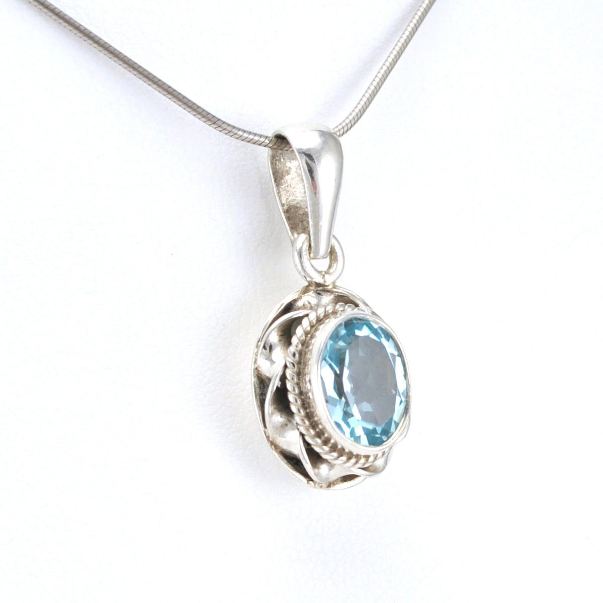 Side View Sterling Silver Blue Topaz 7x9mm Oval Pendant