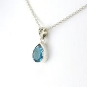 Side View Sterling Silver Blue Topaz 7x10mm Tear Necklace