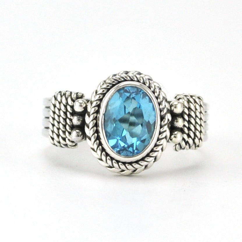 Sterling Silver Blue Topaz 6x8mm Oval 4 Band Ring