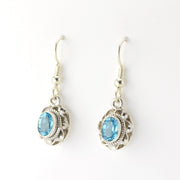 Silver Blue Topaz 5x7mm Oval Dangle Earrings