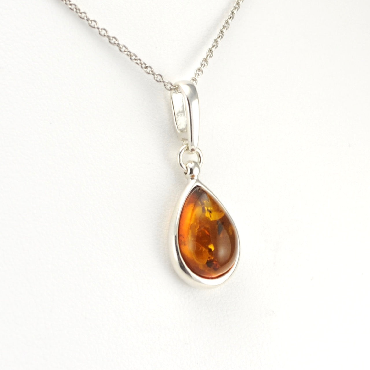 Side View Silver Baltic Amber Teardrop Necklace