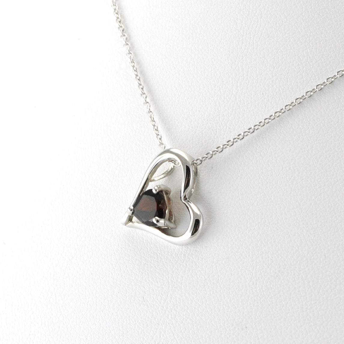 Side View Silver Garnet Heart within Heart Necklace