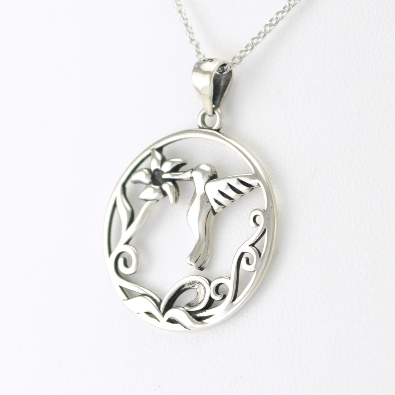 Side View Silver Circle Hummingbird Necklace