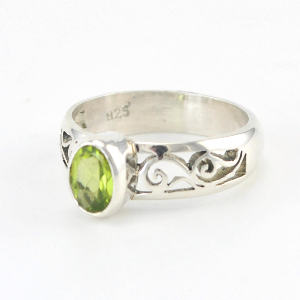 Side View Silver Peridot 5x7mm Scroll Side Band