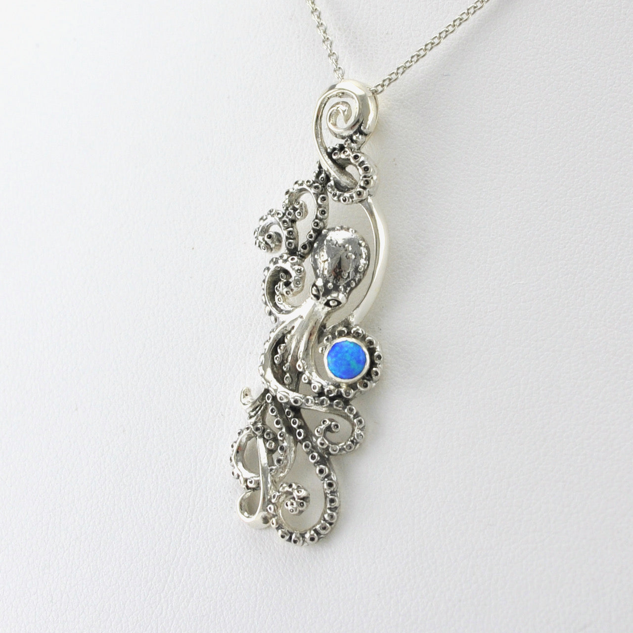 Side View Silver Created Blue Opal Octopus Necklace