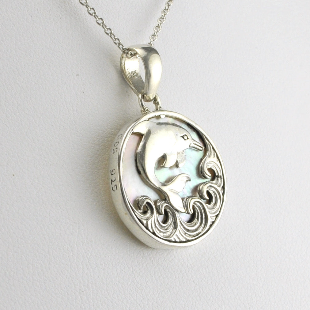 Side View Silver Mother of Pearl Dolphin on Waves Pendant