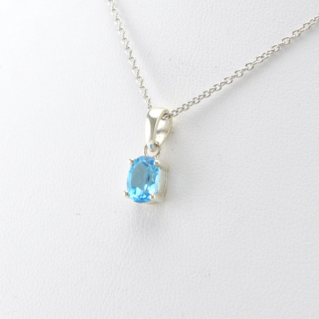 Side View Silver Blue Topaz 5x7mm Oval Necklace