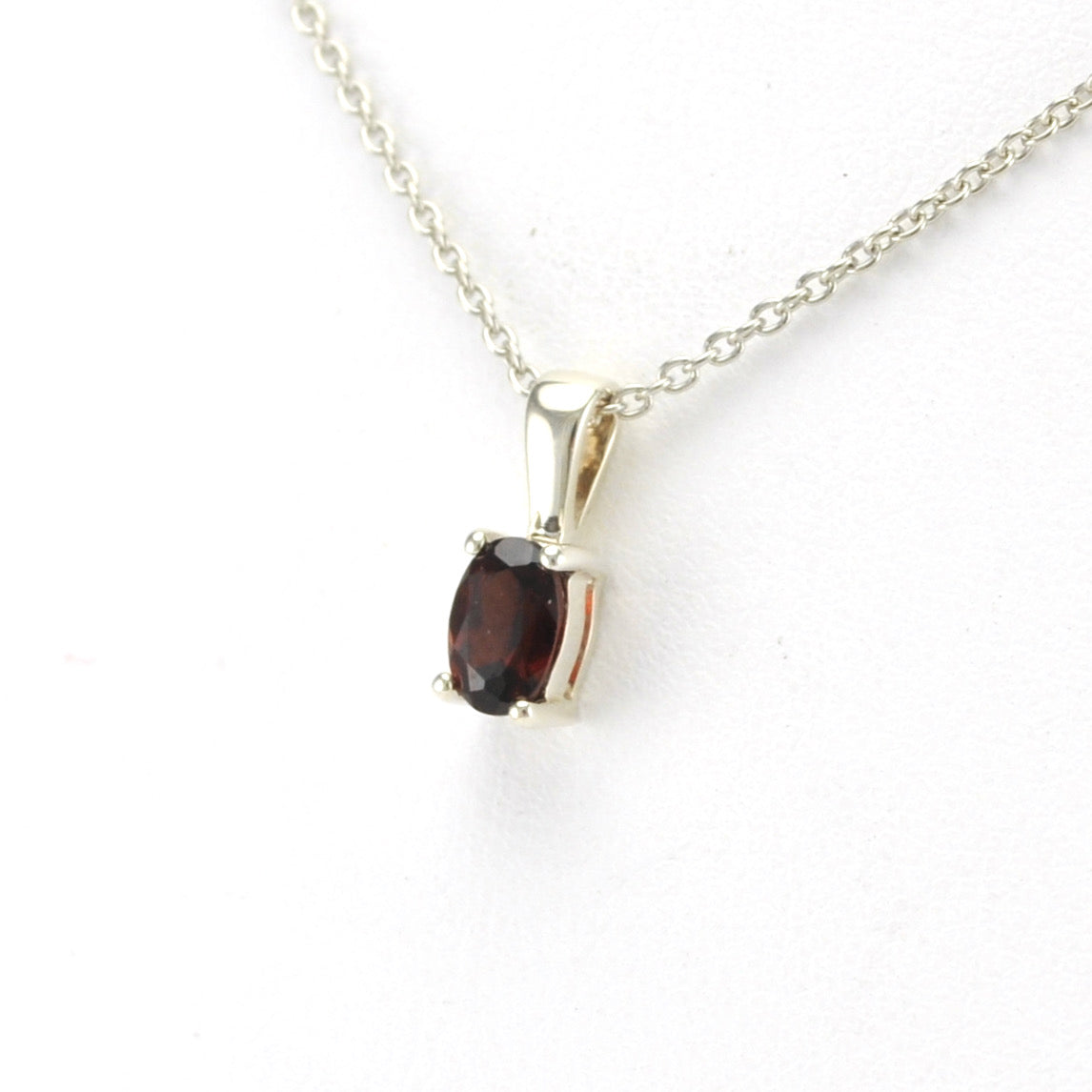 Side View Silver Garnet 4x6mm Oval Necklace