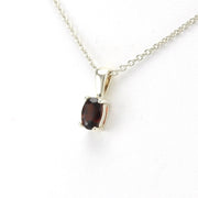 Side View Silver Garnet 4x6mm Oval Necklace