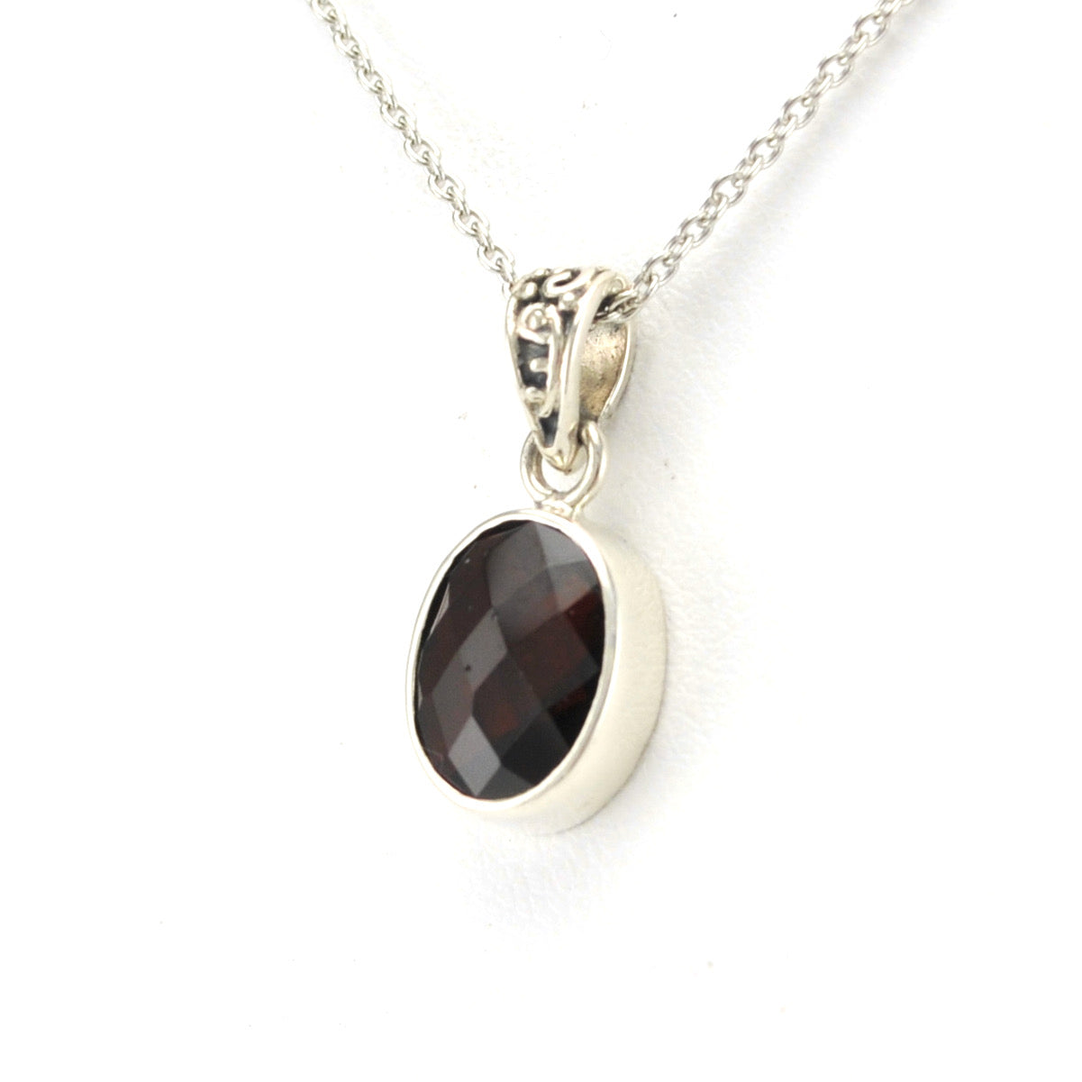 Side View Silver Garnet 8x10mm Oval Necklace
