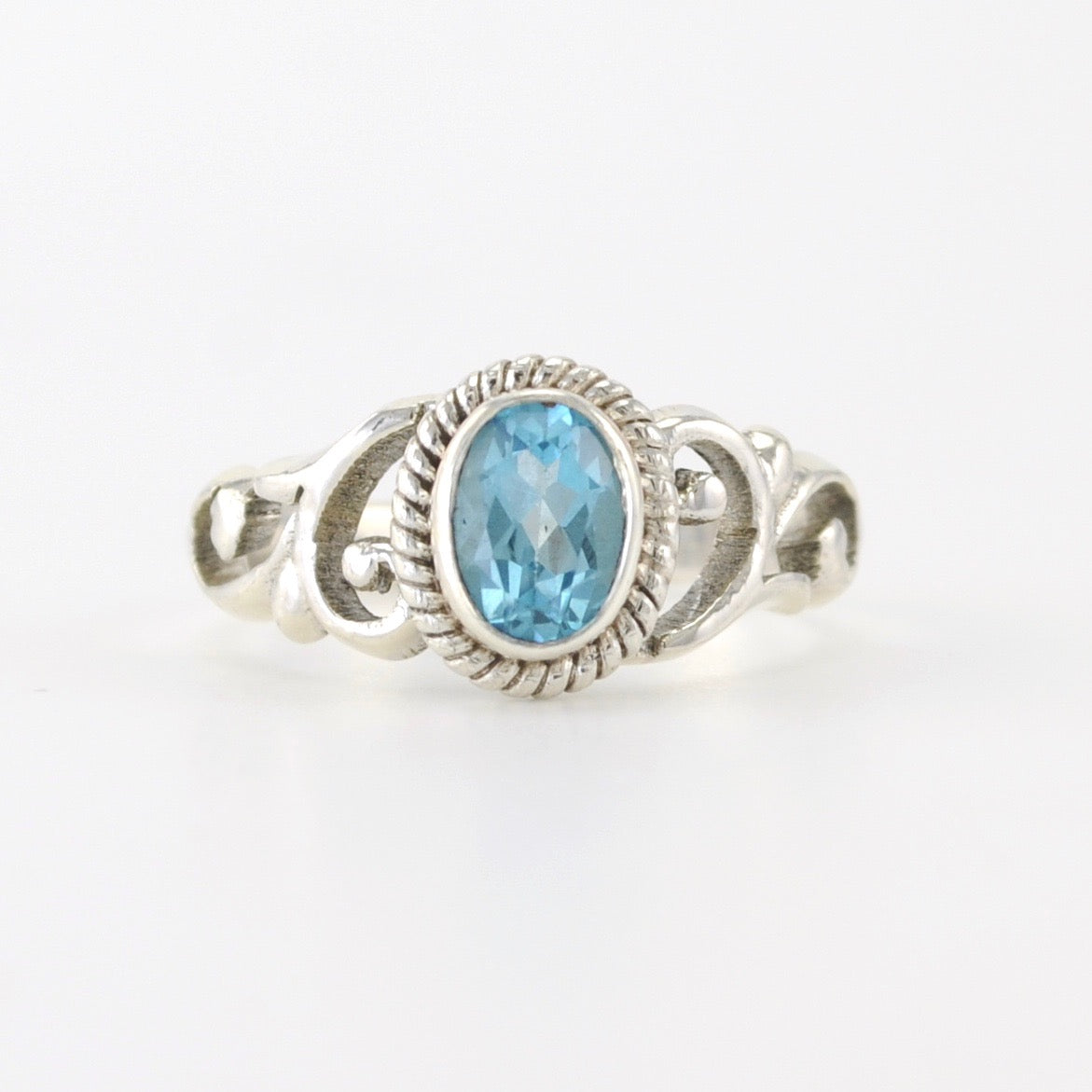 Silver Blue Topaz 5x7mm Oval Scroll Ring