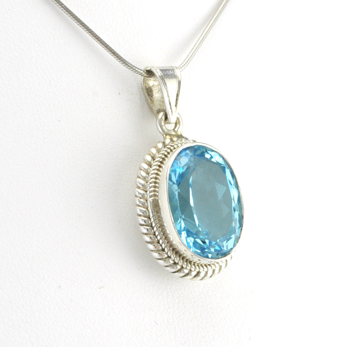 Side View Sterling Silver Blue Topaz 12x16mm Oval Pendant