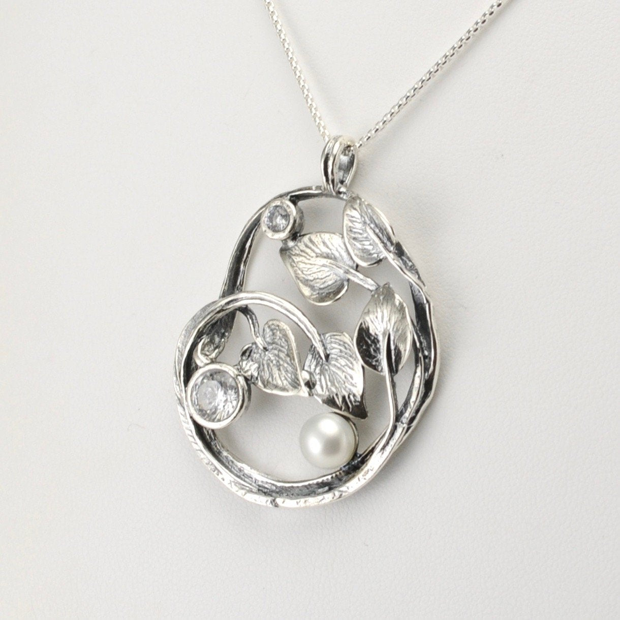 Side View Silver Pearl Cz Leaf Swirl Necklace